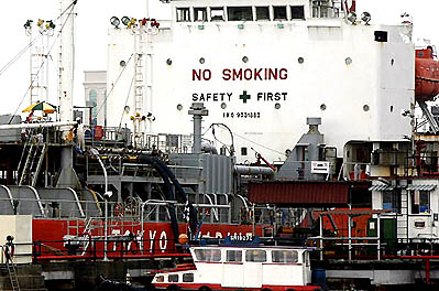 An oil tanker berth storage terminal is seen in Singapore on Thursday. Oil prices stayed above the $72-a-barrel level in Asian trade after hitting a new record high on concerns over tight US supplies and fears of conflict in Iran. The prices reached above $74 a barrel in London