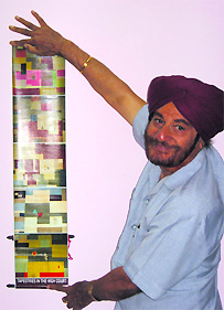 Mr Piara Singh shows wall-hanging pictures of tapestries that are hung in the High Court 