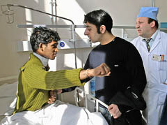 Wounded Indian student Anjani Kumar talks to his friend at a hospital in St. Petersburg in Moscow on Thursday.