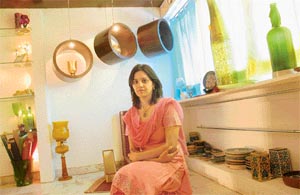 Monita sits amidst her artifacts