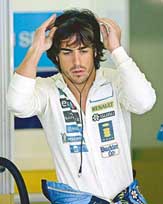 Renault Formula One driver Fernando Alonso of Spain prepares to leave his pit garage after the first practice session of the San Marino Grand Prix in Imola, Italy, on Friday.
