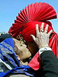 A mother kisses her son after his passing out ceremony at Rangreth, near Srinagar, on Saturday
