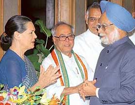 Prime Minister Manmohan Singh is greeted by his Cabinet colleagues and Congress President Sonia Gandhi before his departure for Germany and Uzbekistan at his residence in New Delhi on Saturday.