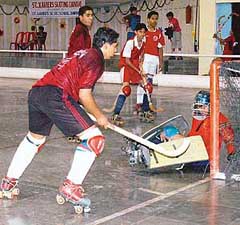 A Sangrur player scores a goal against the Amritsar team in a roller hockey match at St Xaviers Skating Carnival-2006 at the Sector 10 skating rink in Chandigarh on Sunday.