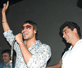 Bollywood actor Vivek Oberoi waves to fans during a promotion of his new film Pyare Mohan as director Inder Kumar looks on, at Delight cinema in the Capital on Sunday. 