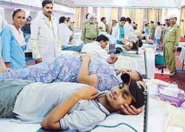 Volunteers donate blood at a camp organised by the Sant Nirankari Mandal in Ludhiana on Sunday.