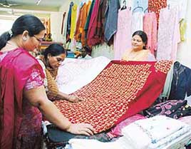 Ludhianvis show keen interest in embroidered suits on display at Nehru Sidhant Kendra in Ludhiana on Sunday.