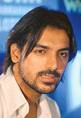 John Abraham speaks at the launch of his clothing line in association with denim major Wrangler in Mumbai on Monday. Abraham joins a new generation of Indian movie stars, who are turning entrepreneurs to cushion the financial blow of life away from the sets.