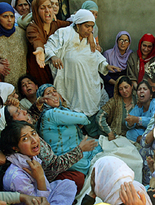 Women mourn the death of Abdul Aziz who was killed in a grenade blast at Khanyar on Monday. 