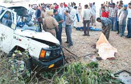 Relatives of the victims try to identify the bodies at the accident site at Mullanpur village, near Chandigarh, on Monday.