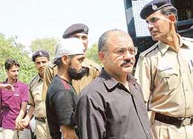 The persons arrested by the police in a late night raid at a bar being produced before a local court in Chandigarh