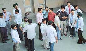 Resident doctors of the GMCH, Sector 32, Chandigarh, stand outside the hospital after giving a call for a strike on 