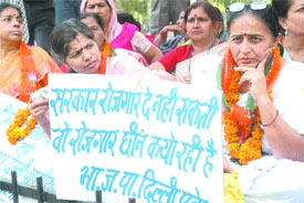 BJP women activists sitting on a dharna against MCDs sealing drive on the last day of the Jail Bharo Andolan, at Jantar Mantar in the Capital on Tuesday