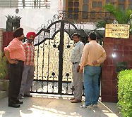 Members of a CBI team guard the entrance to the residence of Mr V.M. Verma, Assistant Commissioner Central Excise, in Atam Nagar, Ludhiana, on Tuesday