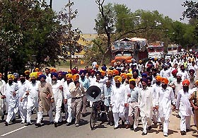 SAD workers hold a protest march to press for the acceptance of the demands of farmers in Gurdaspur on Tuesday