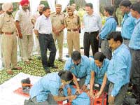CMC staff demonstrate how to provide first aid to accident victims at a seminar in Ludhiana on Wednesday