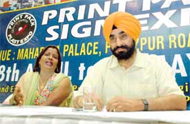 Ms Mira Mathew and Mr D.P. Singh give details of the printing machinery exhibition being organised in Ludhiana