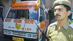 A policeman stands in front of the vehicle to be used in the BJPs rath yatra in Shimla on Wednesday