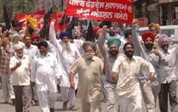 Punjab Roadways employees stage a protest near the residence of Punjab Transport Minister Mohinder Singh Kaypee