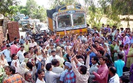 Residents block traffic on the Pathankot-Dalhousie road in protest against inadequate drinking water supply on Thursday
