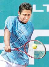 Spains Nicolas Almagro returns the ball to Argentinas Guillermo Coria during their match at the Barcelona Open in Spain