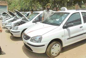 New air-conditioned taxis which will hit the roads in Chandigarh from May 1, being inspected at the office of the State Transport Authority (STA) in Sector 18