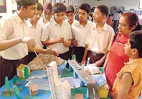 A student explains his science model to a parent during a science exhibition held at Mount Carmel School in Sector 47, Chandigarh