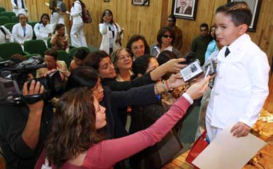 Six-year-old Mexican Maximiliano Arellano de la Noe, with an outstanding memory, is hounded by journalists after delivering the conference Causes and consequences of the osteoporosis for medical school students of the Autonomous University of the State of Mexico, on Friday
