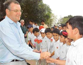 New Zealand Minister for Sports and Recreation Trevor Mallard interacts with upcoming players of St. John's Cricket Academy, Chandigarh