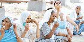Women enjoy ice cream on a sizzling day in Ludhiana
