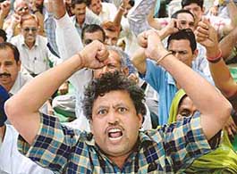 Members of the Federation of UT Employees and Workers, Chandigarh, at a May Day rally in Sector 18 on Monday.