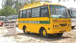 School buses, impounded by the Chandigarh Traffic Police for violation of traffic rules during a special drive on Monday morning, parked in the Sector 29 Traffic and Security Lines in Chandigarh.