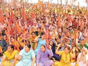 Workers participate in a CITU rally on May Day in Ludhiana