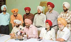 Harmeek Singh, an ex-hockey Olympian, along with his delegation, addresses mediapersons at the Chandigarh Press Club