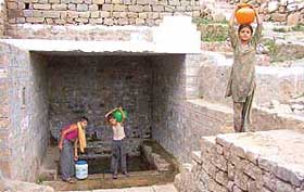 TROUBLED WATER: Where children walk miles to fetch water.