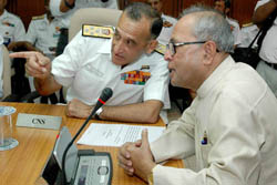 Indian Navy Chief Admiral Arun Prakash discusses a point with Defence Minister Pranab Mukherjee at the Naval commanders conference in New Delhi on Tuesday. 