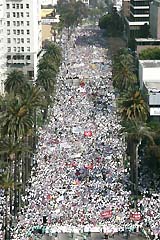 Thousands of demonstrators in support of immigration reform march along Wilshire Boulevard in Los Angeles on Monday