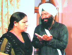 Artistes enacting a scene during the shooting of the telefilm