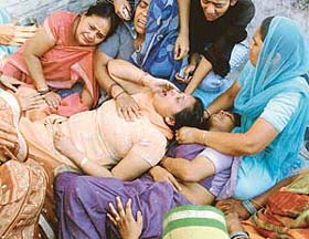 Relatives of Raghubir Sharan and Shakuntala Devi, who were murdered on Wednesday afternoon, in a state of shock in Mohali