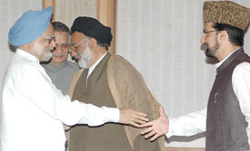 Mirwaiz Omar Farooq (right) and another Hurriyat leader with Prime Minister Manmohan Singh before talks in New Delhi on Wednesday. 