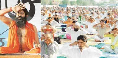 Swami Ramdev demonstrates a yoga asan on the inaugural day of the yoga camp at Dugri in Ludhiana on Wednesday; and (right) a huge crowd at the camp