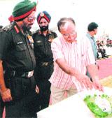 Army Chief General J. J. Singh taking a look at the model of a new Army welfare housing scheme at Greater Noida on Thursday