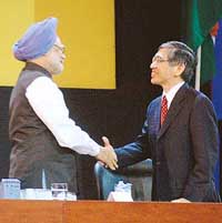The ADB President, Mr Haruhiko Kuroda, shakes hand with the Prime Minister, Dr Manmohan Singh, at the opening session of the ADB Board of Governors meeting in Hyderabad on Friday. 