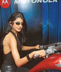 A model poses with Motorola's bluetooth stereo eyewear at a press conference in New Delhi on Friday. Motorola launched MobileME, a portfolio of bluetooth wireless devices which allows a customer to stay connected to calls and music with wireless freedom.