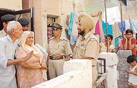 The SHO of the Industrial Area police station, Mr Baljit Singh Chadha, meets senior citizens in Sector 30, Chandigarh, on Friday