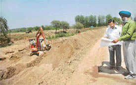 Engineers of the Chandigarh Administration work out the details for a second lake at the Botanical Garden in Chandigarh on Friday