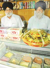Sardar Ishwar Singh (right) and his son Satpal Singh of Baba Dairy