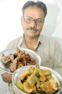 Pickle-expert Vinod Kumar proudly showing his Mango pickle and Chilli pickle that have wooed many