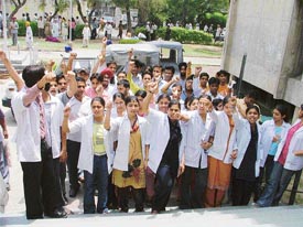 Students of Lord Mahavira Homoeopathic Medical College hold a demonstration at mini secretariat in protest against the opening of a liquor shop near the college 