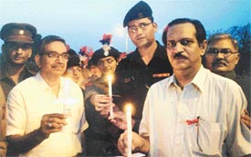 Lt Col K. Atri, Commanding Officer, 1 Pb R&V Sqn NCC, flanked by Dr K.S.Roy, Dean, College of Veterinary Science, and Dr Jand lead a candlelight procession to mark World AIDS Orphans Day